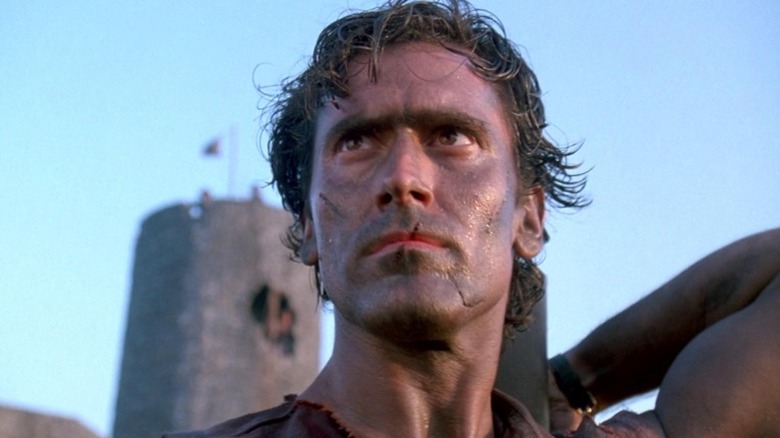 Ash Williams (Bruce Campbell) looks into the distance in Army of Darkness