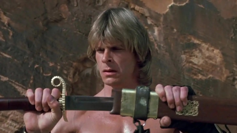 Dar unsheathes a sword