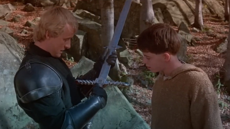Navarre (Rutger Hauer) shows his sword to Matthew Broderick as Gaston