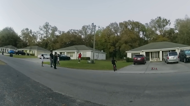 A police bodycam captures children playing in a neighborhood in The Perfect Neighbor.