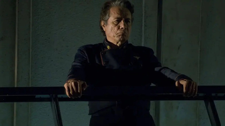 William Adama holding onto a railing on Battlestar Galactica