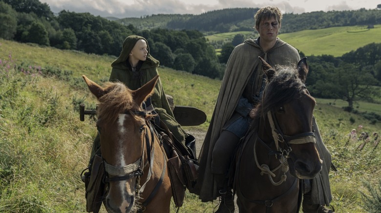 Dexter Sol Ansell as Egg riding a horse next to Peter Claffey as Dunk in the countryside in A Knight of the Seven Kingdoms