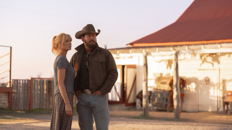 Cole Hauser's Rip Wheeler and Kelly Reilly's Beth Dutton stand side by side outside their ranch home in Dutton Ranch