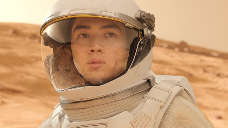 Alex looking in surprise at the vast Martian horizon in For All Mankind