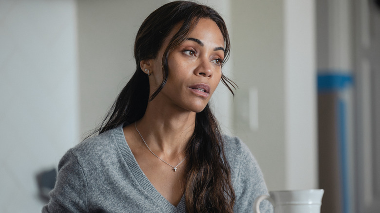 Zoe Saldaña's Joe McNamara is seen in closeup as she sits in her kitchen in Lioness