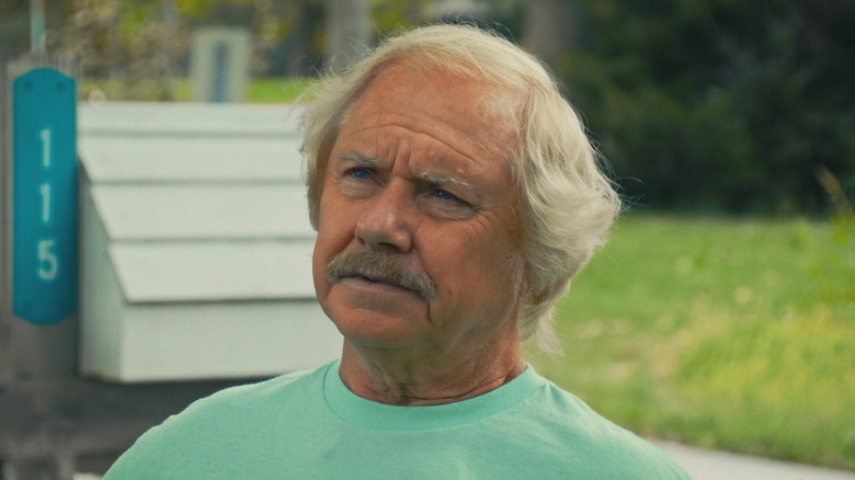 Darrell Blasius stands outside looking confused in Neighbors