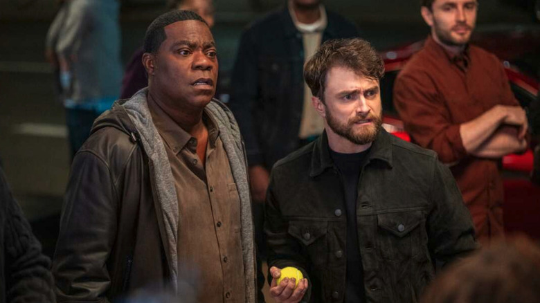 Reggie Dinkins (Tracy Morgan) and Arthur Tobin (Daniel Radcliffe) look concerned in The Fall and Rise of Reggie Dinkins