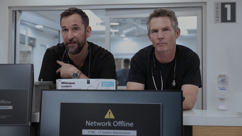 Dr. Robby and Dr. Abbott next to each other looking at someone off camera in The Pitt Season 2