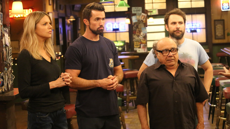 Kaitlin Olson as Dee, Rob McElhenney as Mac, Danny DeVito as Frank, and Charlie Day as Charlie in It's Always Sunny in Philadelphia