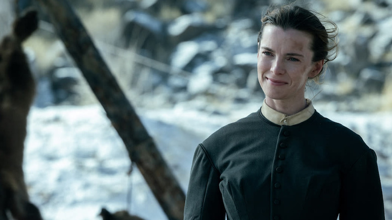 Betty Gilpin as Sara standing outside in American Primeval