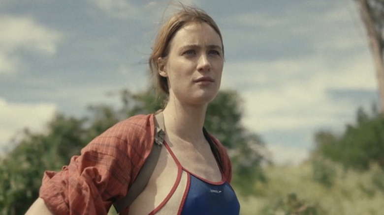 Mackenzie Davis as Kirsten standing outside in Station Eleven