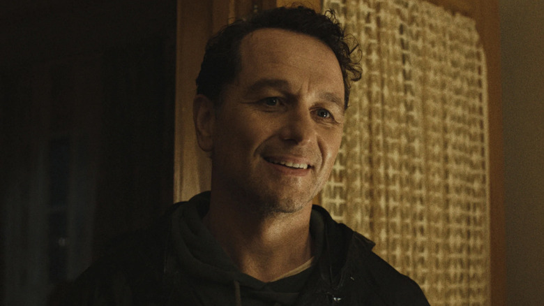 Matthew Rhys as Tom, smiling in Widow's Bay