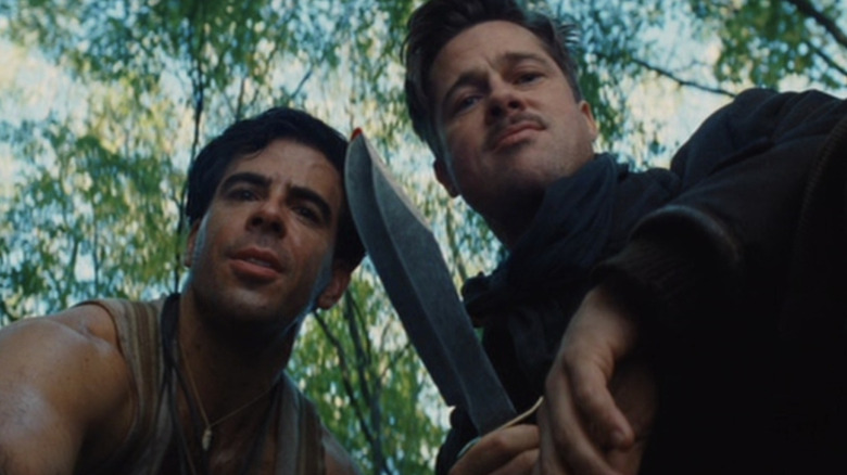Sgt. Donny (Eli Roth) and Lt. Raine (Brad Pitt) about to scalp a German soldier in Inglourious Basterds
