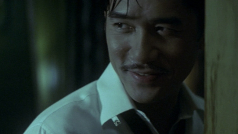 Chow (Tony Leung) smiles in 2046