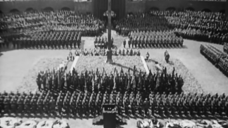 Documentary footage of German soldiers marching with flags