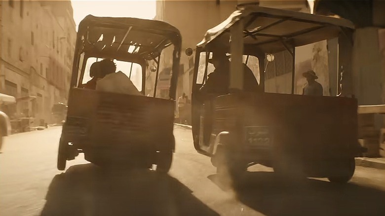 Indy and Helena race tuk-tuks