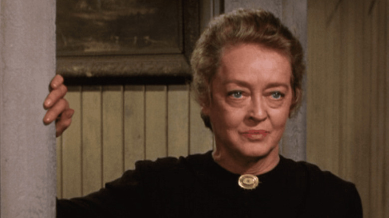 Etta Stone in a black dress on Gunsmoke.
