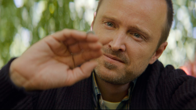 Black Mirror, David in Cliff's body, looking at a caterpillar on his hand