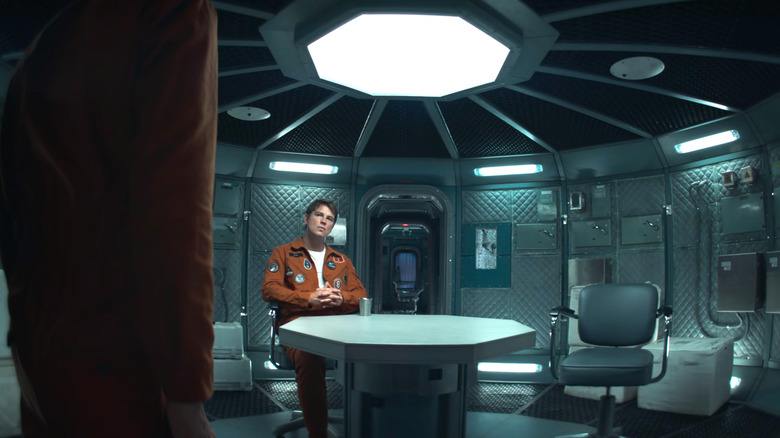 Black Mirror, David pushing out a chair for Cliff to sit down in