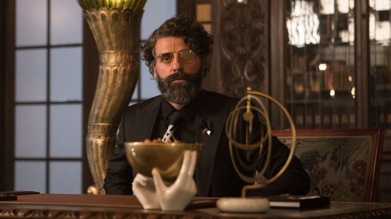 Oscar Isaac in a black suit in Big Gold Brick