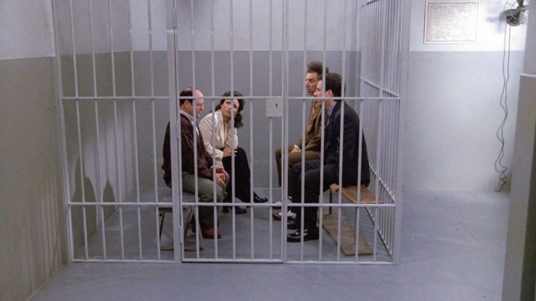 George, Elaine, Kramer, and Jerry, sitting in a prison cell on Seinfeld.