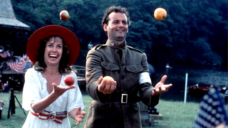 Larry Darrell juggles oranges with Isabel