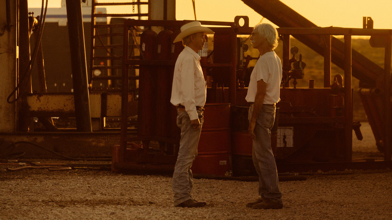 Sam Elliott's T.L. Norris stands opposite Billy Bob Thornton's Tommy Norris next to an oil rig in Landman
