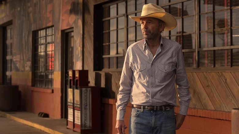 Tommy Norris stands outside a building in Landman