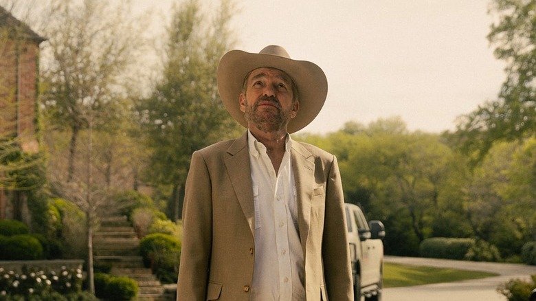 Tommy Norris standing in a garden on Landman