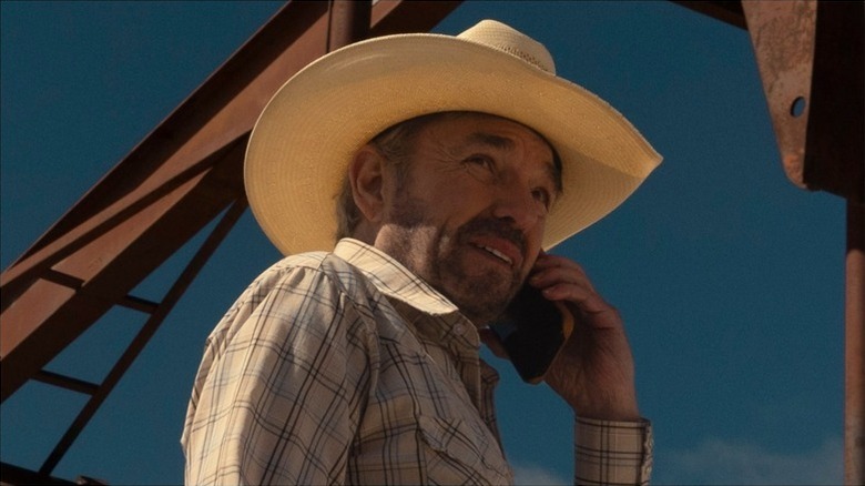 Tommy Norris has a phone on his ear on Landman
