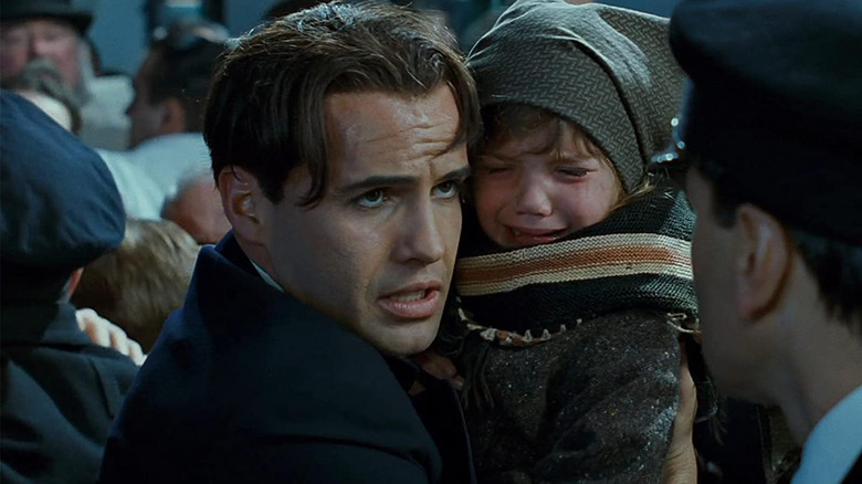 Cal with a crying child in Titanic