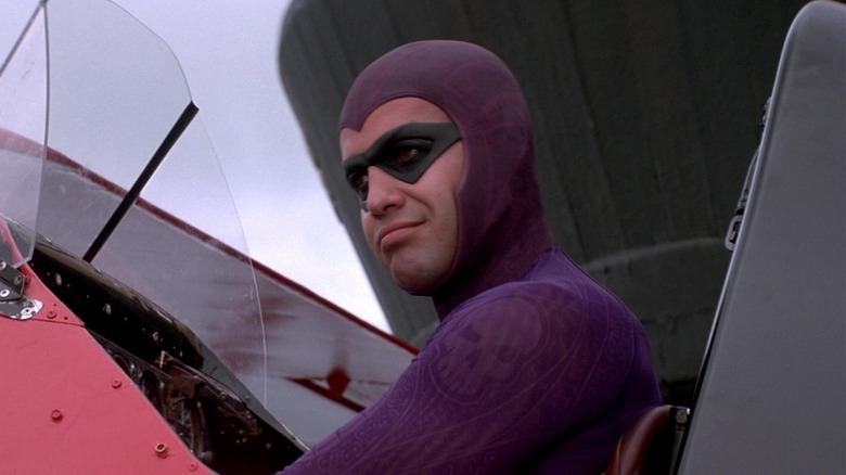 Billy Zane as Kit Walker/Phantom siting in the cockpit of a plane in The Phantom
