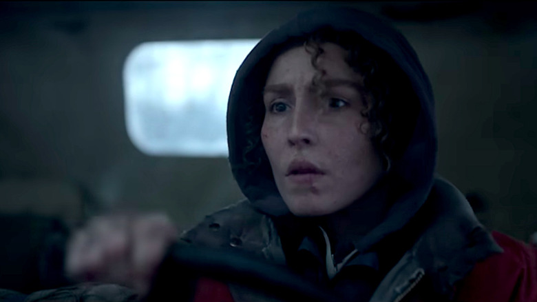 Caroline drives a truck while looking concerned