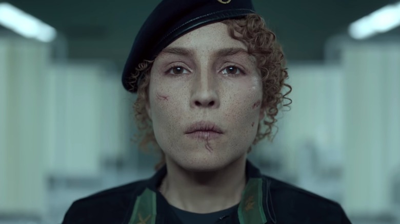 Noomi Rapace injured, soldier uniform