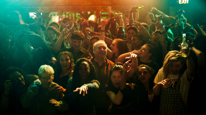 Phillip surrounded by a crowd at a concert in Black Mirror season 7