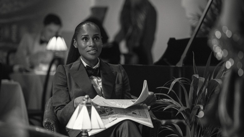 Dr. Alex Palmer reading the newspaper during filming in Hotel Reverie