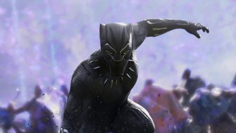 Black Panther fighting in Black Panther with a purple haze behind him