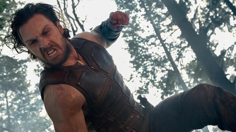 Aaron Taylor-Johnson angrily punching things in Kraven the Hunter