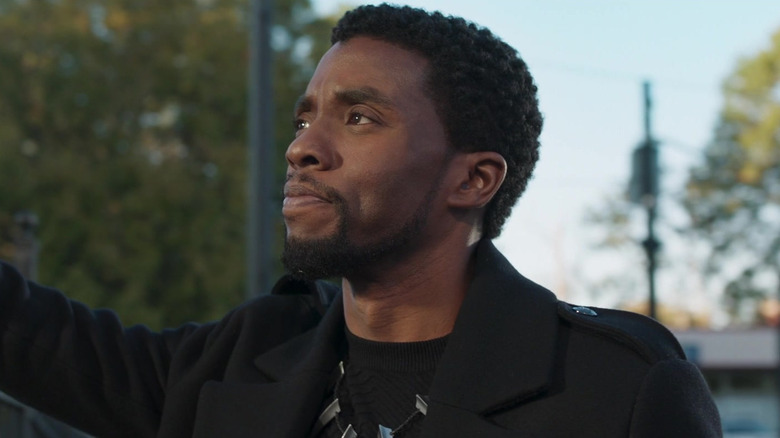 Chadwick Boseman as T'Challa looking thoughtful in Black Panther