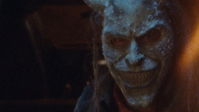 A close up of Ethan Hawke as The Grabber in the front seat of his van in Black Phone 2