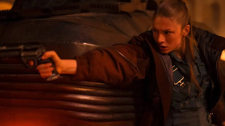 Cora aims a gun in Blade Runner 2099