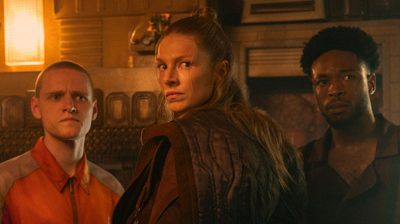 Cora (Hunter Schafer) looks over her shoulder in Blade Runner 2099