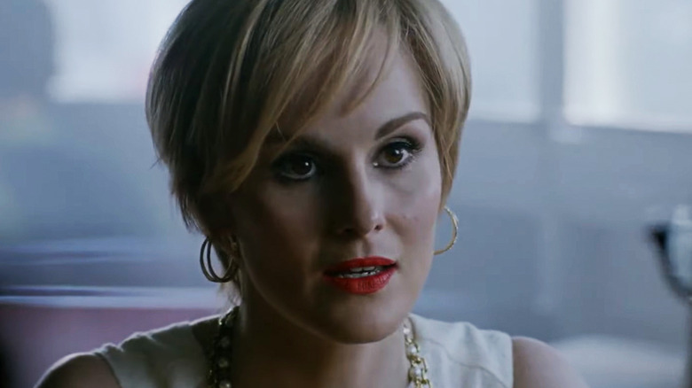Michelle Dockery's Leticia Raines looks across frame as she sits in a restaurant in Good Behavior