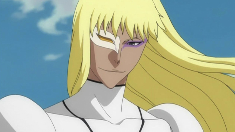 A blonde person standing against a blue sky in Bleach