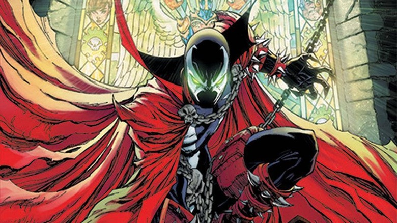 Spawn crouched in front of stained glass in a church on the cover for Spawn #301