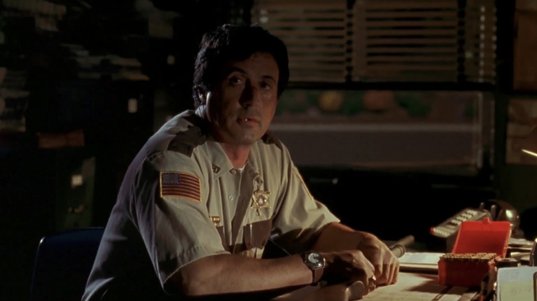 Sylvester Stallone's Sheriff Freddy Heflin looks up as he sits at his desk in Cop Land