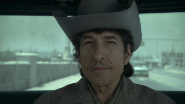 Jack Fate sitting in a car in Masked and Anonymous