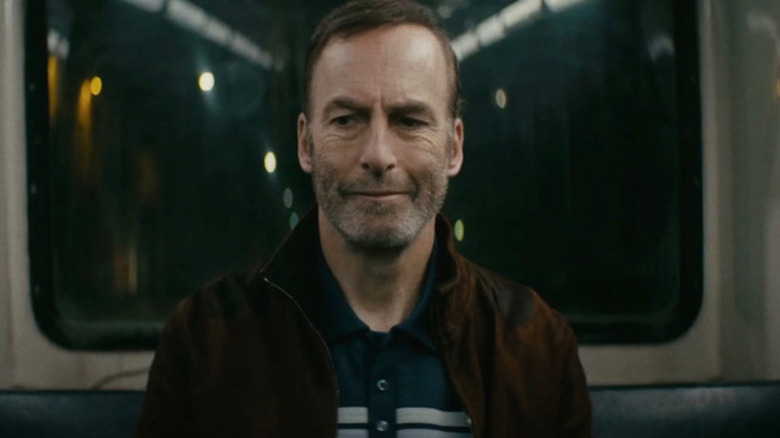 Hutch Mansell (Bob Odenkirk) smirks before everything explodes on a bus in Nobody