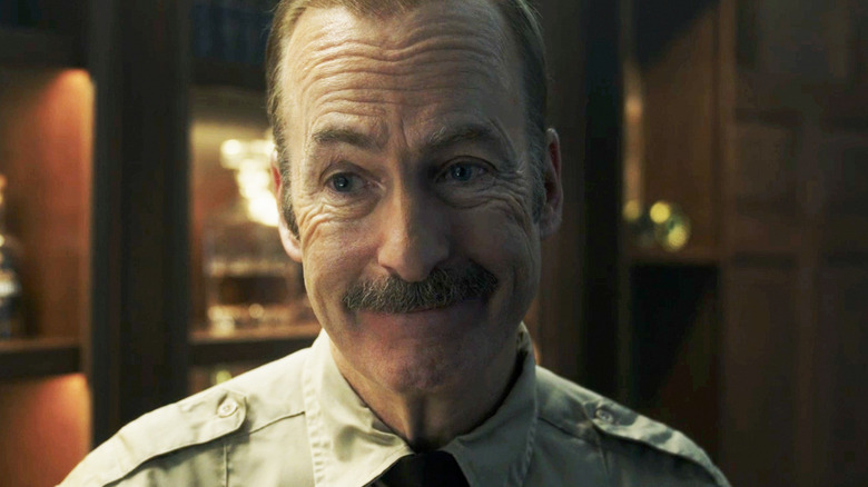 Bob Odenkirk's Sheriff Ulysses smiles in closeup in Normal