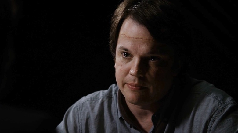 Eric Millegan's Zack Addy looks across the room while being interrogated in Bones